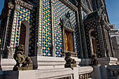 Bangkok Grand Palace,  Wat Phra Keow (temple of the Emerald Buddha). Chapel is finished in glazed ceramic tiles near the Gandharara Buddha. 